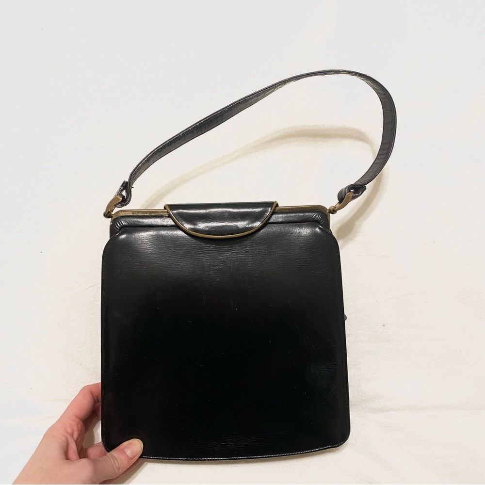 Vintage black leather handbag with gold hardware
